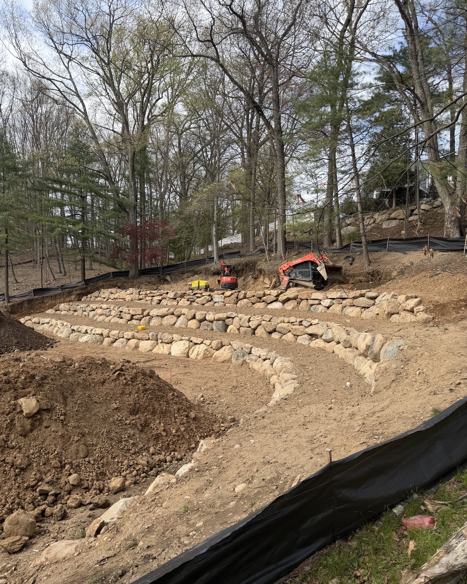 MW Landworks completed multi-tier boulder wall project