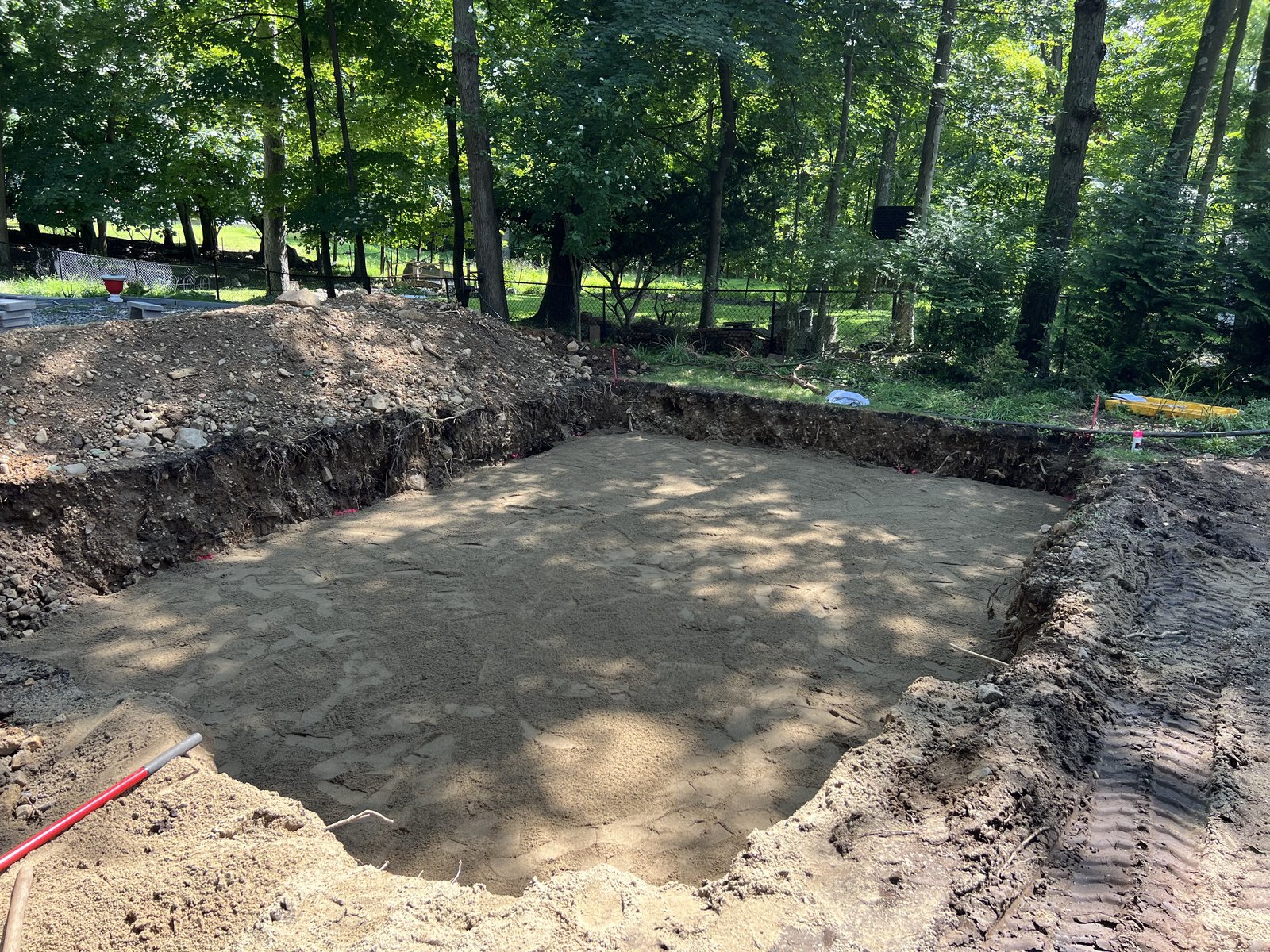 Clean pool excavation with sand base